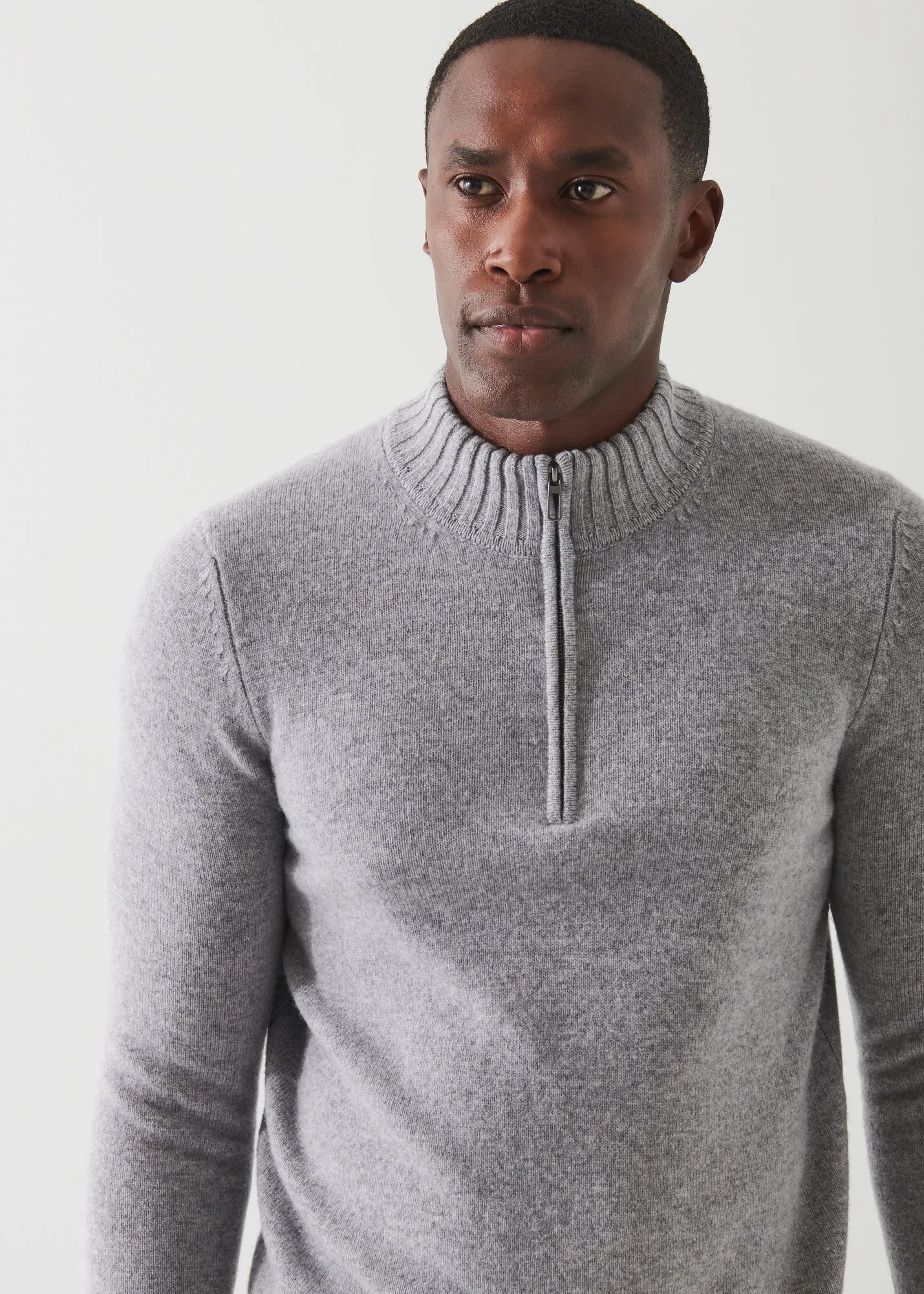 MERINO QUARTER ZIP SWEATER