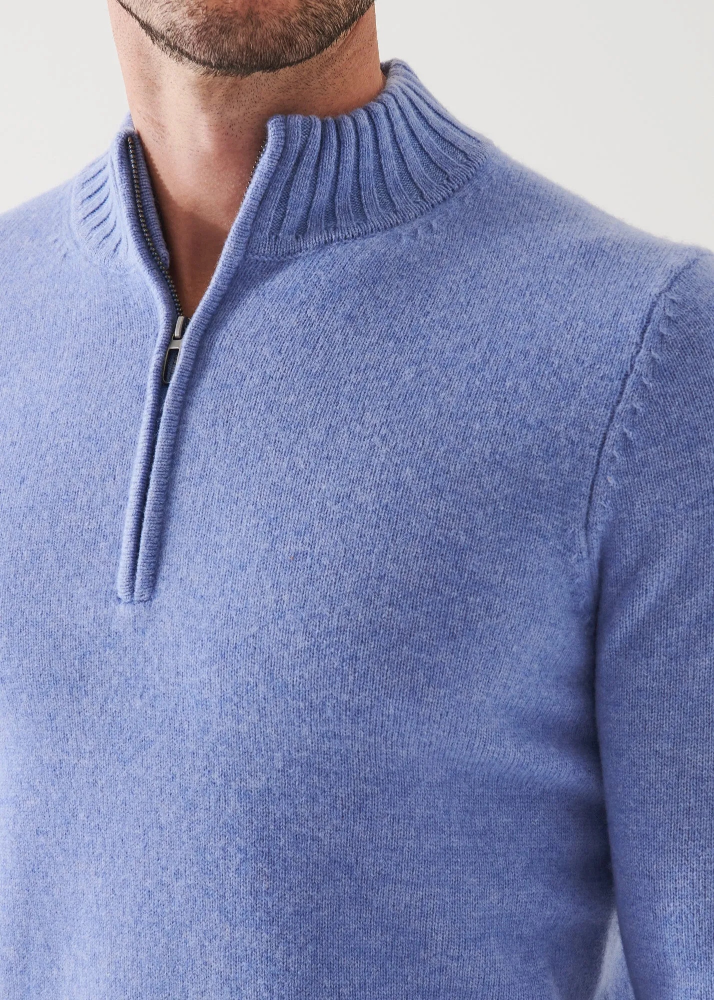 MERINO QUARTER ZIP SWEATER